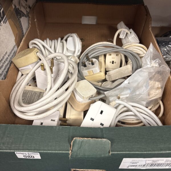 Assortment of extension leads and plugs for electrical connections.