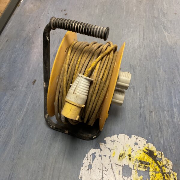 Yellow extension cable reel for garden and DIY use.