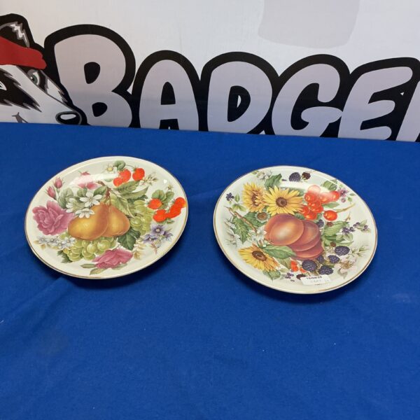 Vintage Fenton China collectors plates with floral designs.