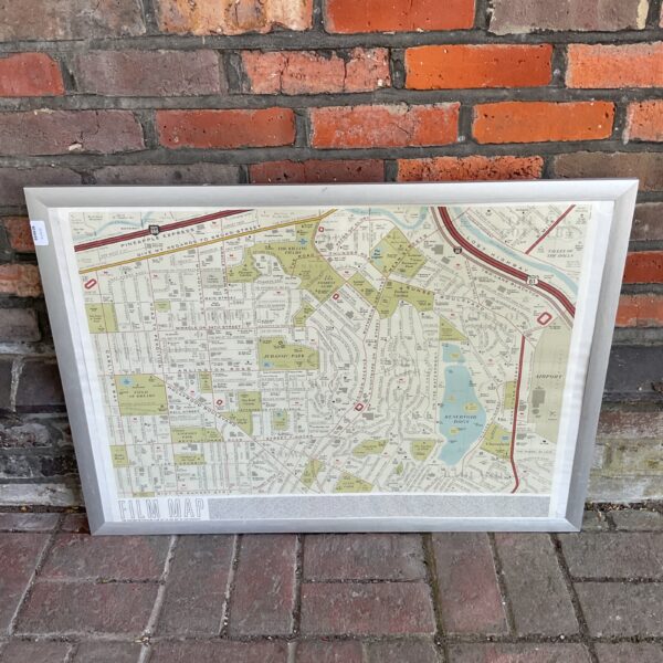Large framed film history map with detailed cinematic cartography.