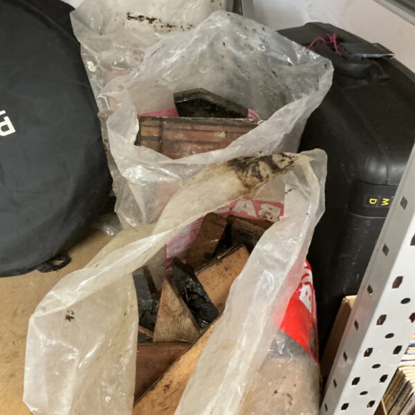 Three bags of firewood ready for burning.