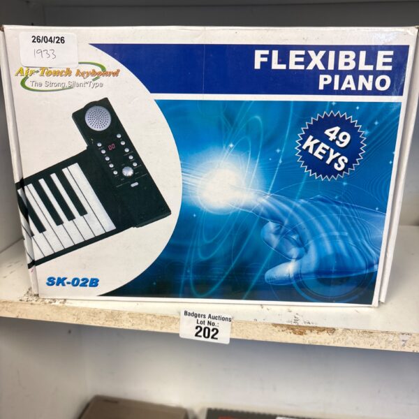 Boxed flexible piano SK02B, a vintage electronic keyboard.