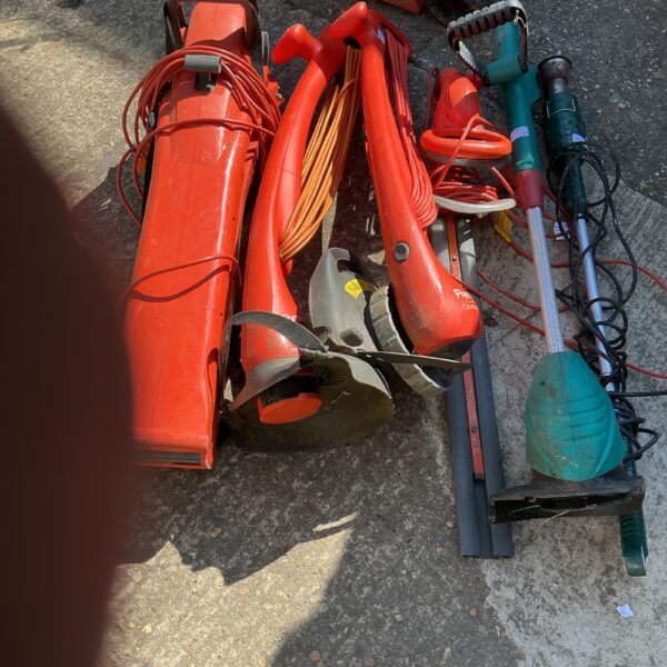 Selection of used Flymo electric strimmers for garden maintenance.
