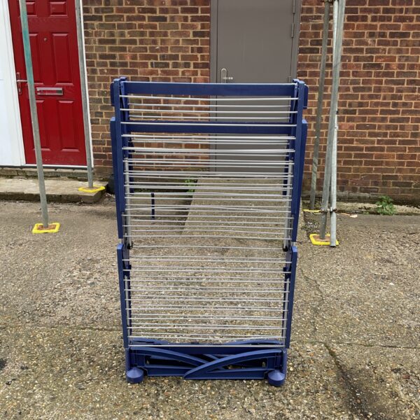 Blue folding clothes airer for indoor laundry drying.