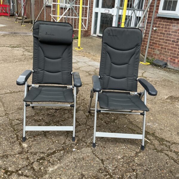 Pair of folding garden chairs for outdoor use.