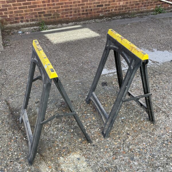 Pair of folding saw horses for DIY and garden projects.