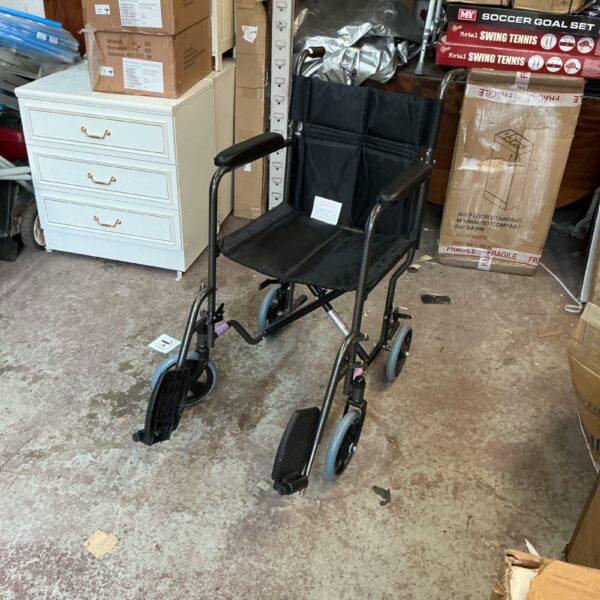 Used folding wheelchair with a lightweight frame and padded seat.