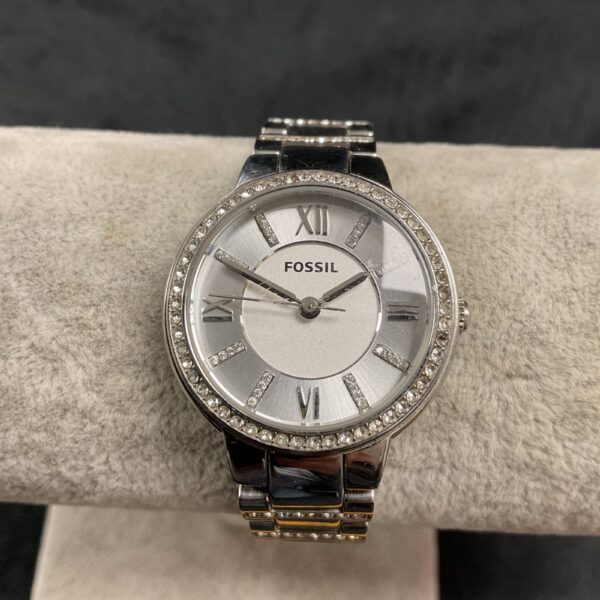 Silver tone Fossil ladies quartz watch with crystal bezel.