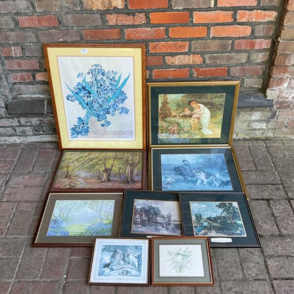 Collection of framed landscape prints in vintage style.