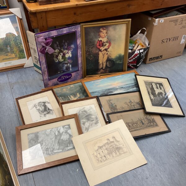 Collection of framed prints and artwork, including dog portraits.