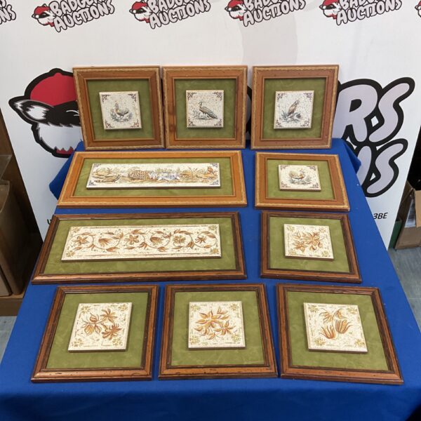 Vintage framed terracotta tiles depicting birds and fauna.
