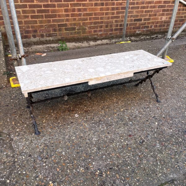 Antique French marble top table with cast iron base.