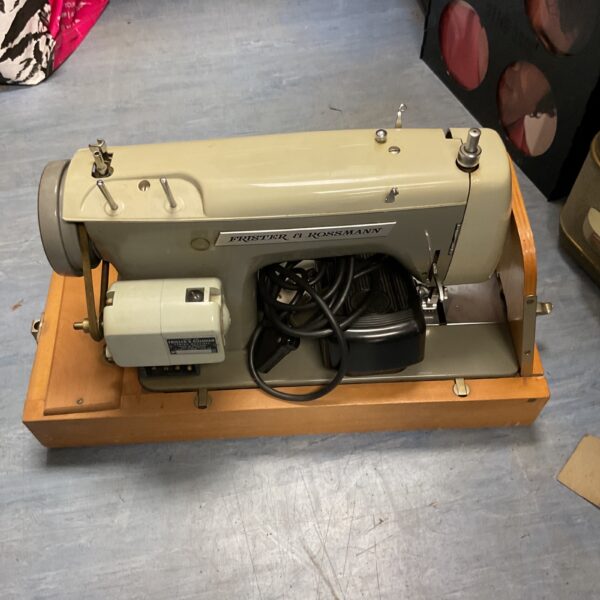 Vintage Frister & Rossmann sewing machine in used condition.