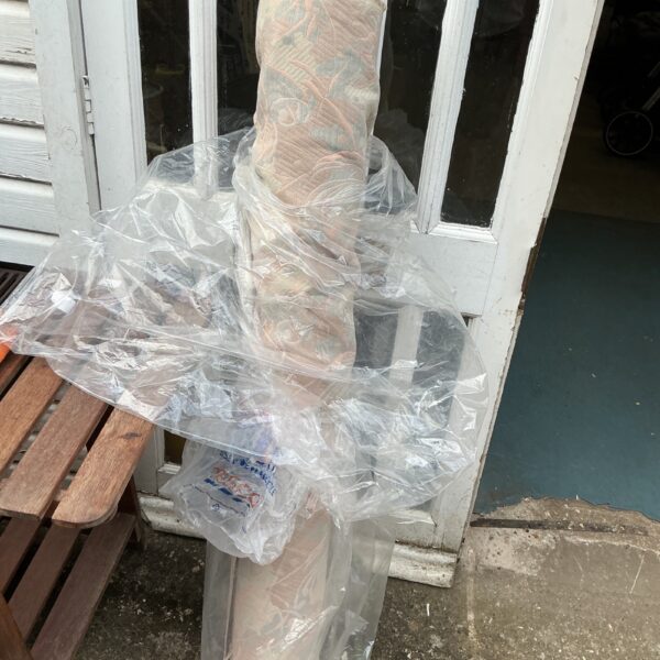 Roll of patterned furniture upholstery fabric for home decor.