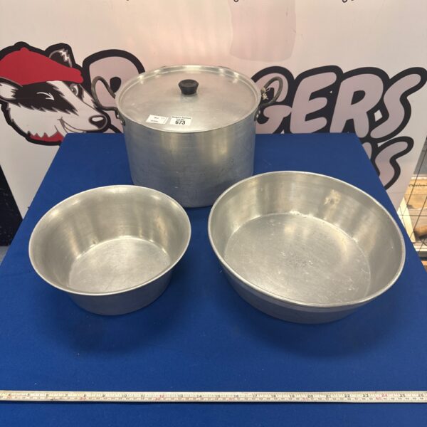 Large galvanised bowls and cooking pot for kitchen use.