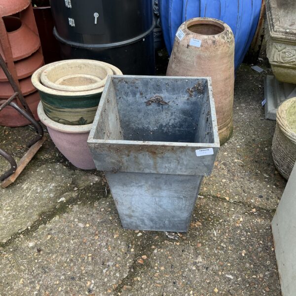 Vintage galvanised garden planter with weathered patina.