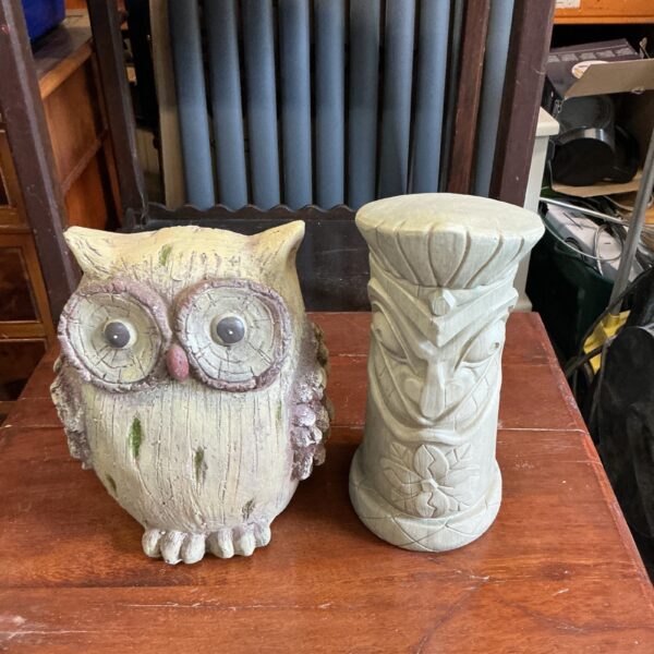 Detailed concrete garden owl ornament for outdoor display.