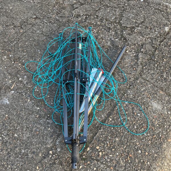 Used garden rotary clothes airer for outdoor laundry drying.