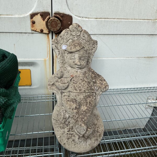 Vintage concrete garden sleeping man figurine for outdoor display.