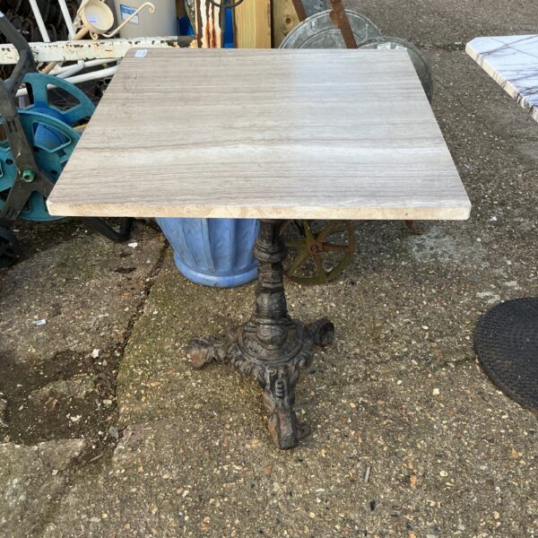 Vintage garden table with stone effect top and cast iron base.