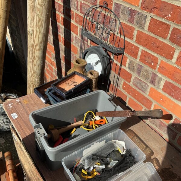 Garden tool lot with plastic toolbox and terracotta pots.