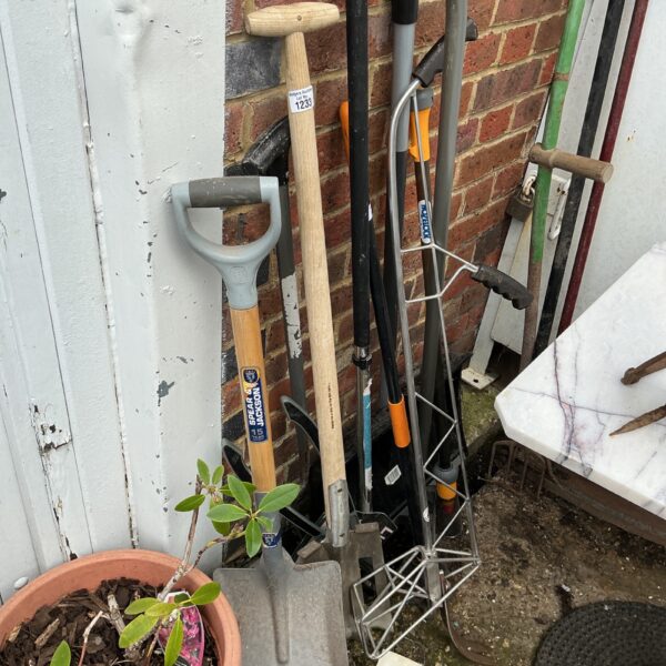 Collection of garden tools including a Spear and Jackson shovel.