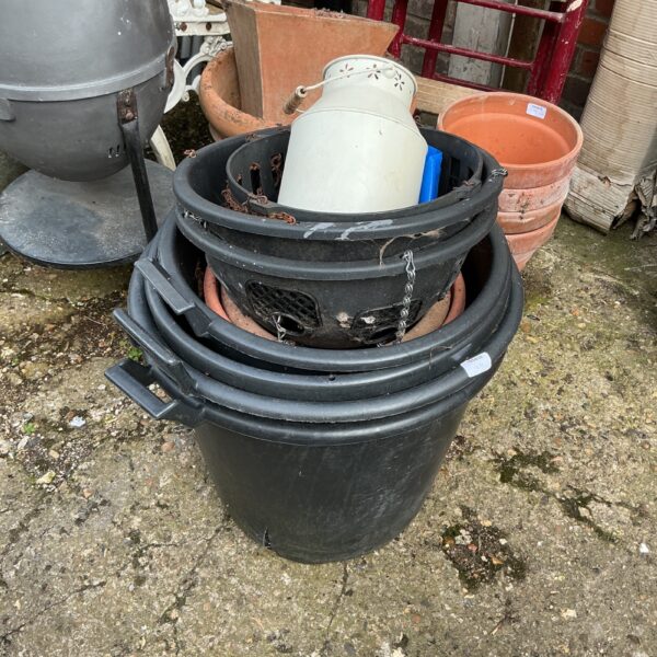 Lot of plastic garden tubs and baskets for gardening.