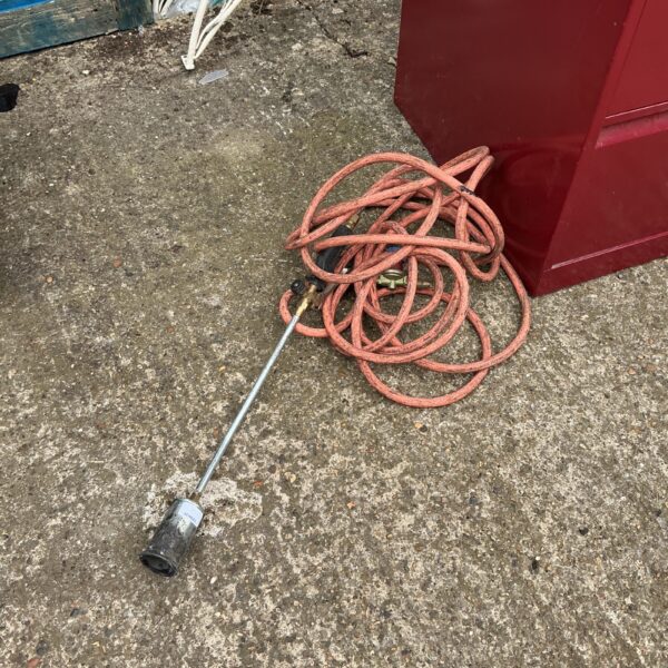 Used gas burning lance with regulator for garden and DIY tasks.