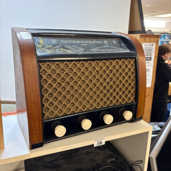 Vintage G&C valve radio with wooden cabinet and dials.