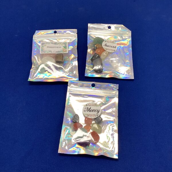 Sealed bags of tumbled gemstones for collecting and crafting.