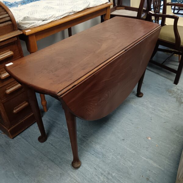 Antique Georgian mahogany drop leaf table with cabriole legs.