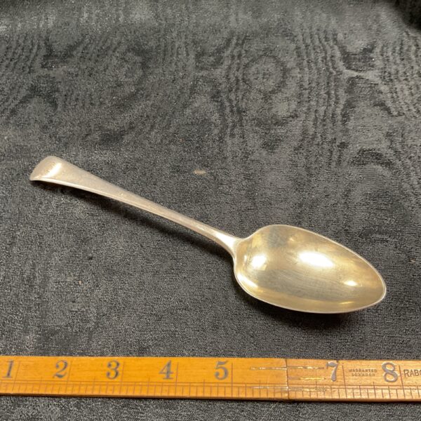 Antique Georgian silver desert spoon, detailed view.