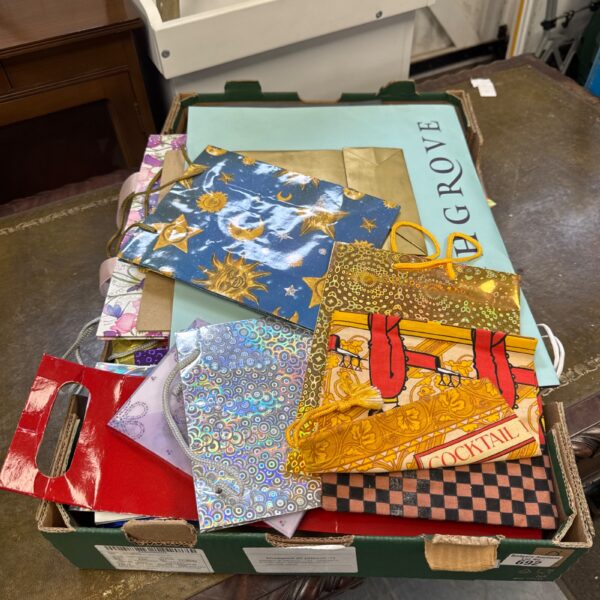 Tray of assorted decorative gift bags for parties and presents.