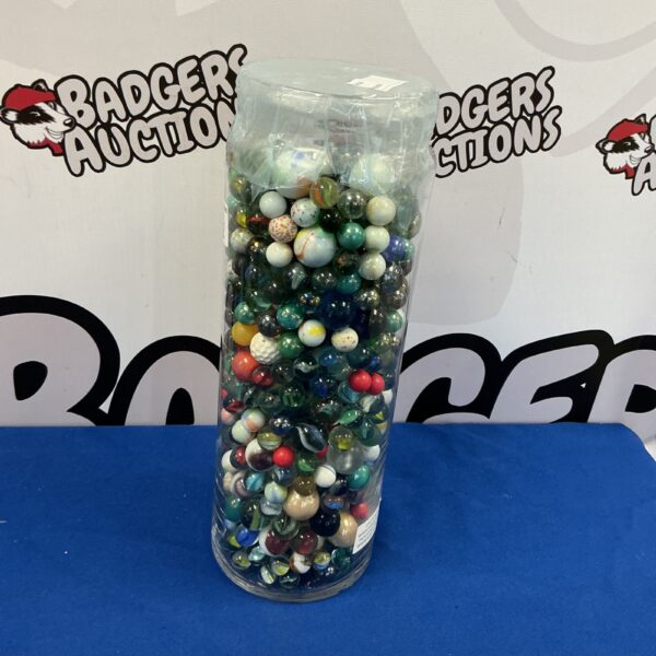 Clear glass jar filled with colourful vintage glass marbles.