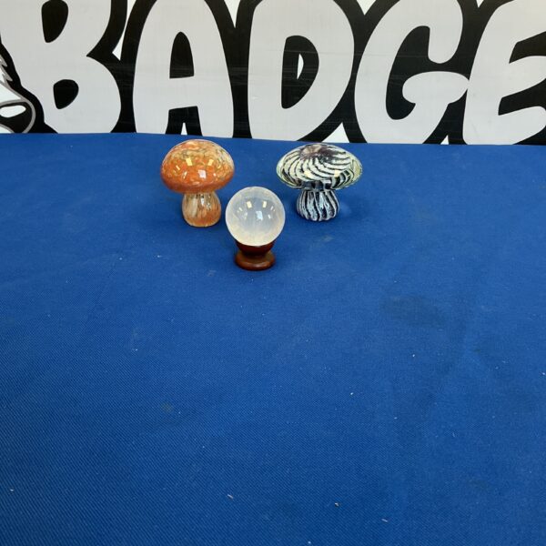 Vintage glass mushroom paperweights with orb on stand.