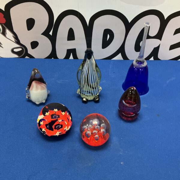 Colourful vintage glass paperweight collection with glass bell.