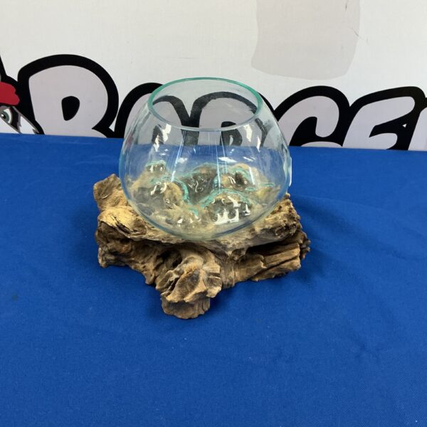 Unique handcrafted glass vase on driftwood base for home decor.