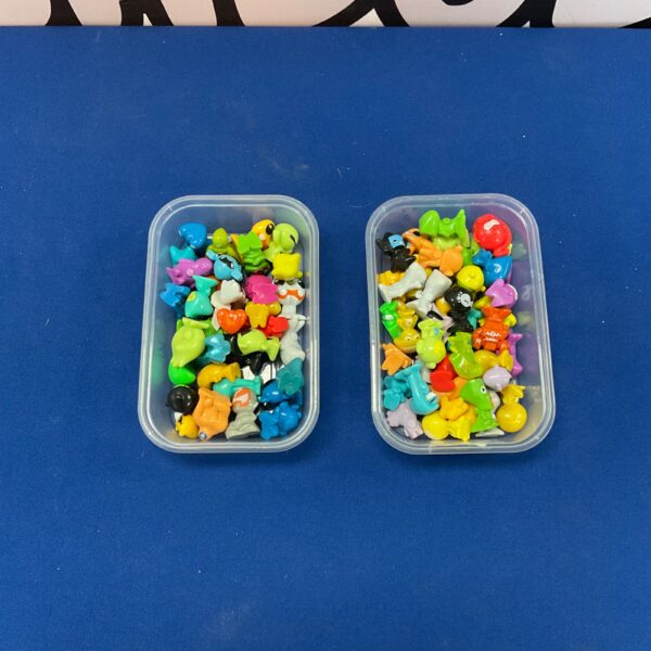 Colourful tray of collectible GoGo figures, miniature toy lot.