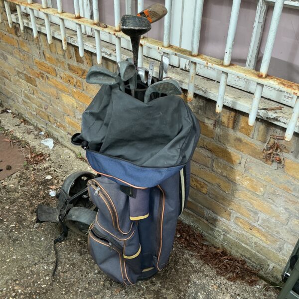 Vintage golf clubs with navy tour bag for sale.