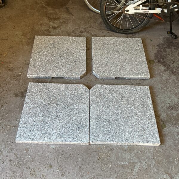Set of two granite patio bases for outdoor use.
