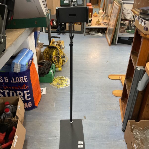 Black Gravity tablet floor stand with adjustable height and steel base.