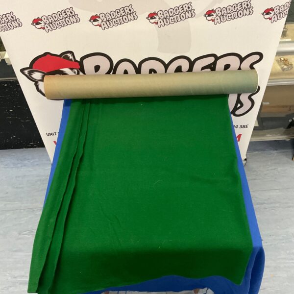 Close-up of a green interlocking puzzle mat for kids.