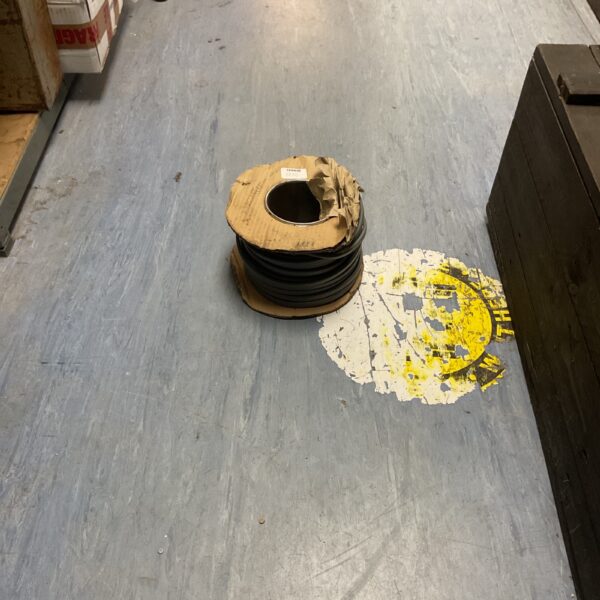 Grey roll of twin and earth electrical cable for wiring projects.