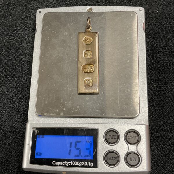 Hallmarked silver ingot weighing 15.3 grams, collectible bullion.