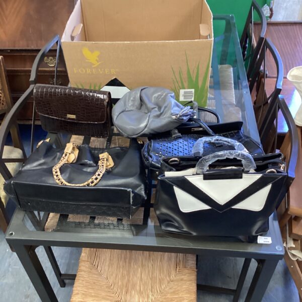 Assorted vintage and designer handbags in a mixed lot.