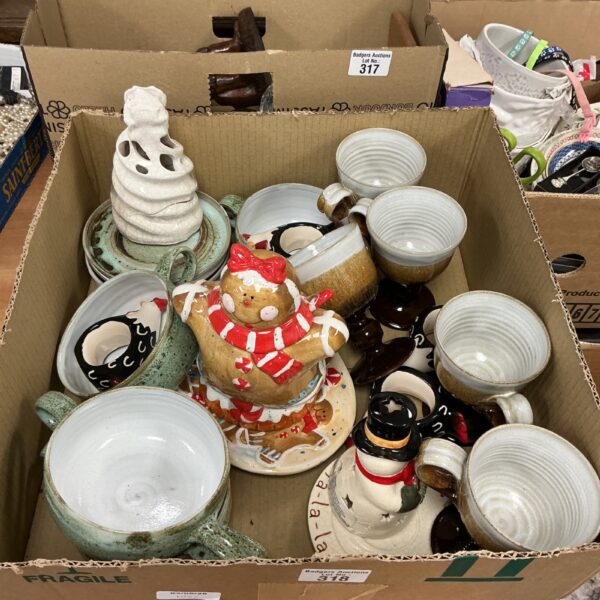 Handmade glazed pottery collection featuring a gingerbread figurine and various ceramic pieces.