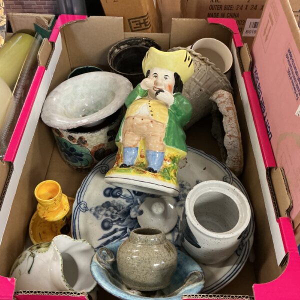Handmade pottery collection featuring a vintage Toby Jug.