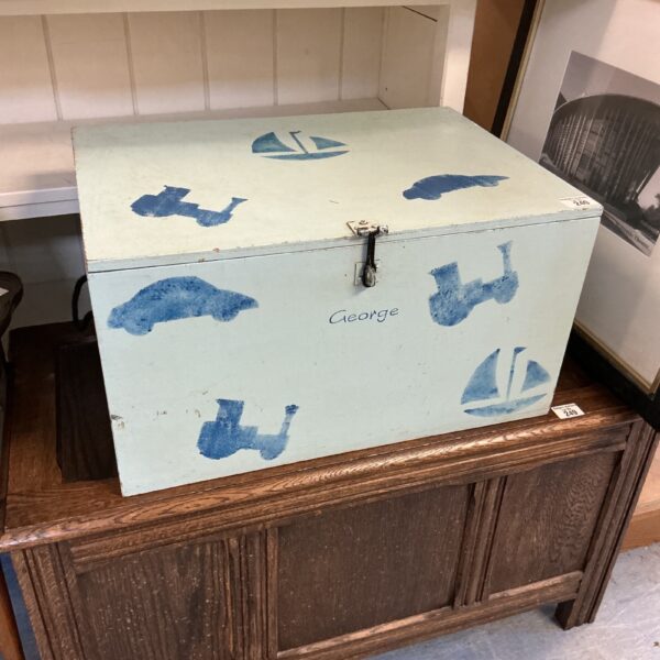 Vintage handpainted wooden toy box with whimsical design.
