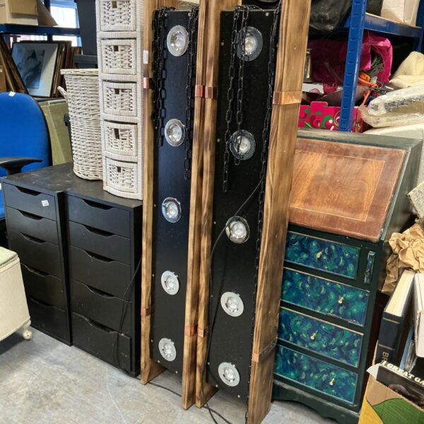 Vintage industrial hanging spotlight units with adjustable lights.