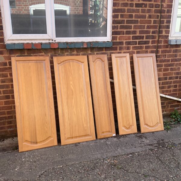 Lot of five hardwood kitchen doors with raised panels.